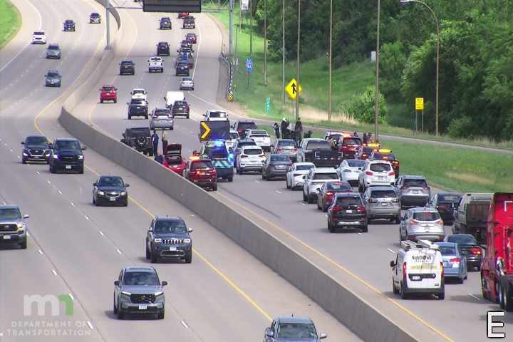 Police car with lights on the shoulder