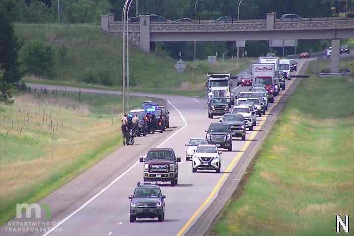 Police cars and officers on the right shoulder