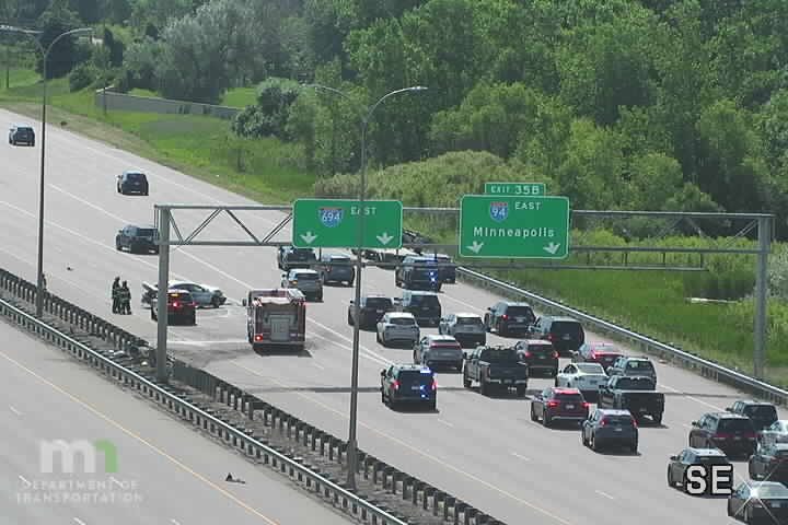 Multiple emergency vehicles and damaged cars in the left lanes