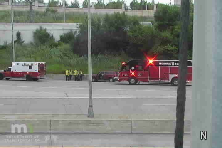 Ambulance and fire truck with lights on the shoulder
