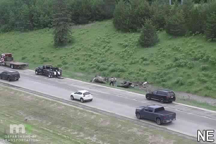 Debris and two individuals in the right lane
