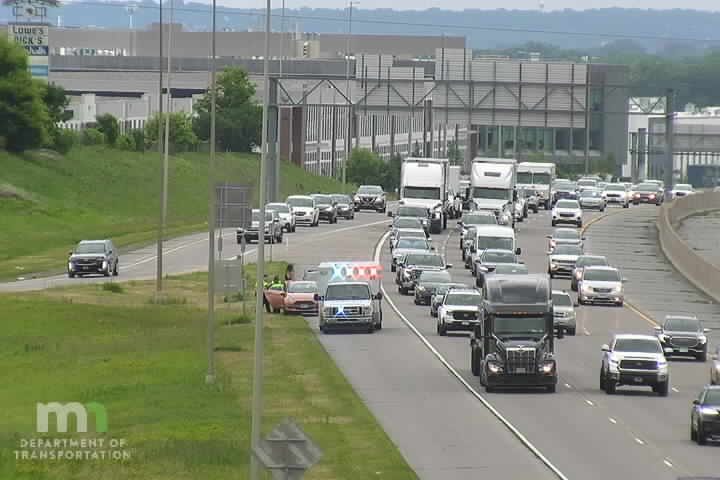 Police car with red and blue lights on the shoulder