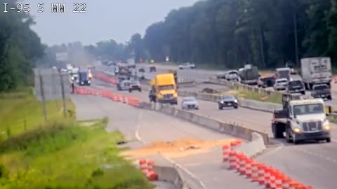 Orange debris and construction barrels in the right lane