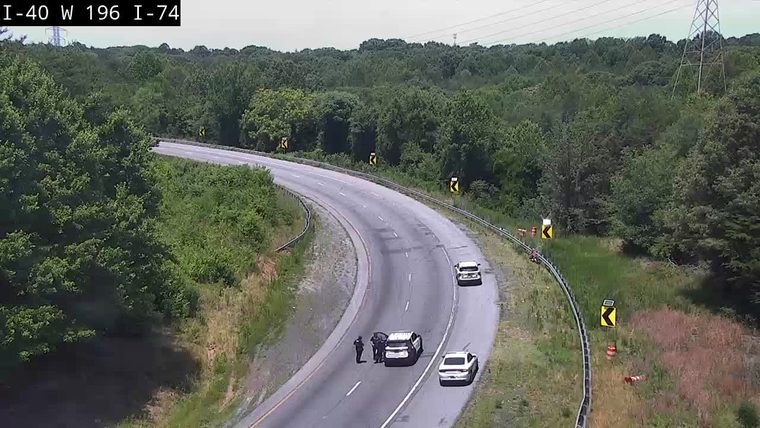 Two police officers with a stopped vehicle in the left lane