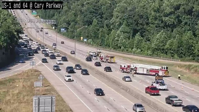 Fire trucks and police are on the scene of an incident on the highway.
