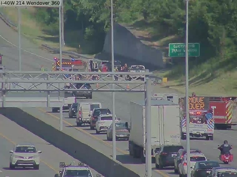 Multiple emergency vehicles and personnel on the roadway