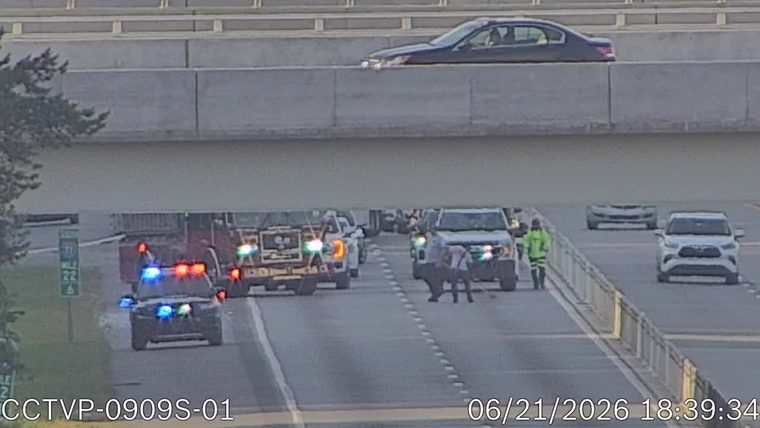 Police car with blue and red lights on the roadway