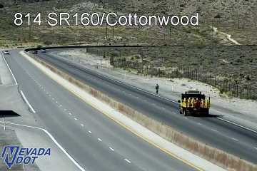 Construction cones and workers in the right lane