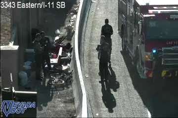 Fire truck with red and blue lights on the right shoulder