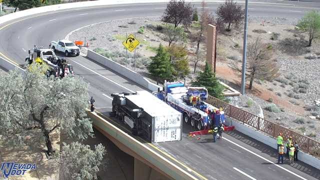 Overturned semi-trailer truck in the right lane