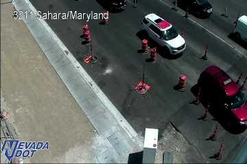 Construction cones and workers in the roadway