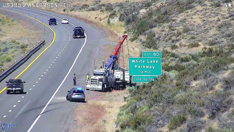Police car and tow truck with crane on the right shoulder