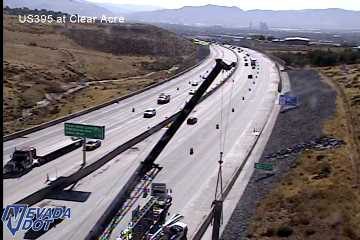Construction equipment and workers in the right lane