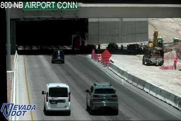 Construction cones and workers in the right lane