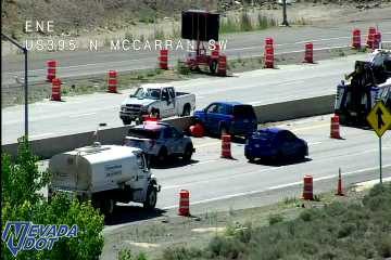 Construction cones and workers in the right lane