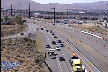 Construction cones and a worker in the right lane