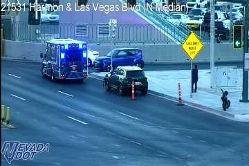 Ambulance with blue and red lights on the roadway