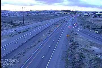 Red vehicle on the right shoulder of the exit ramp