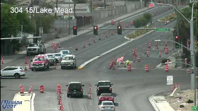 Construction worker and cones in the right lane