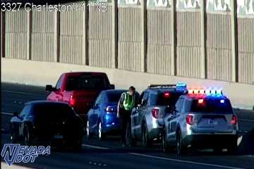 Police car with red and blue lights on the roadway