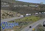 Overturned white trailer on its side blocking the roadway
