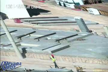 Construction worker in the middle of the roadway