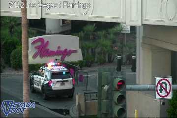 Police car with lights on the roadway