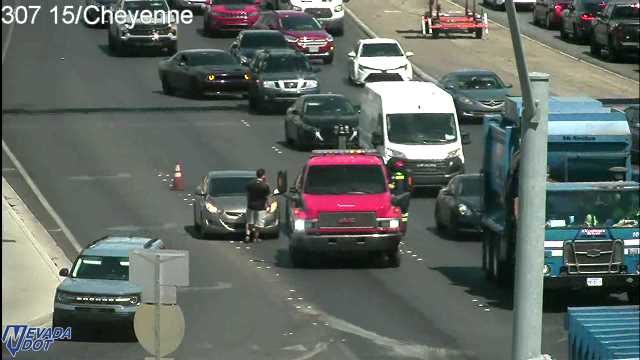 Red truck with emergency lights on the roadway