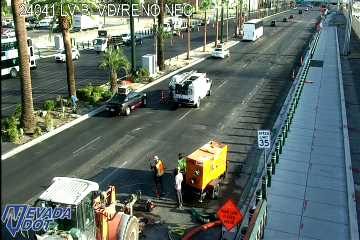 Construction equipment and workers in the right lane