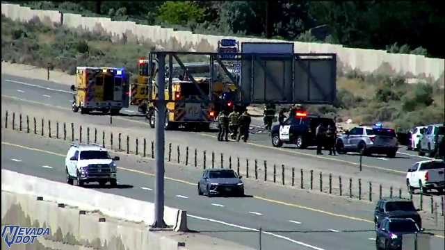 Multiple emergency vehicles and personnel in the roadway