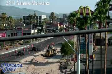 Construction equipment and workers in the roadway