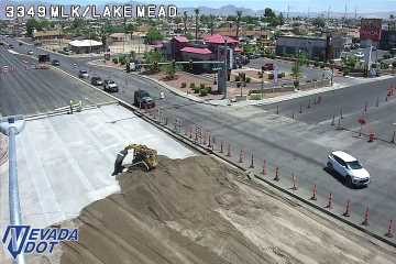 Construction equipment and dirt pile in the left lane