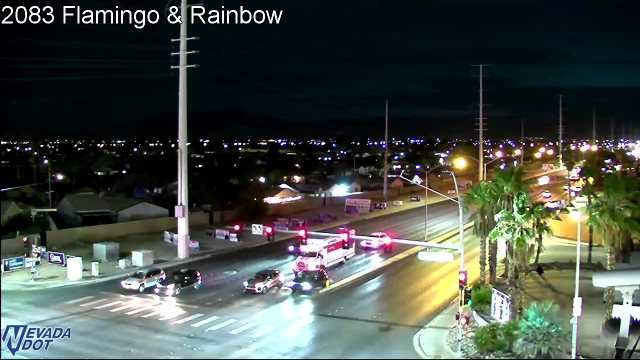 Ambulance and other vehicles stopped in the intersection