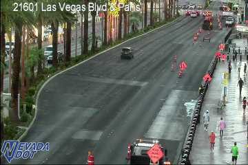 Construction cones and workers in the right lane