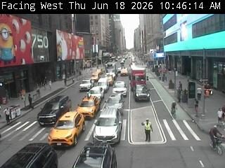 Traffic officer directing traffic in the middle of the road.