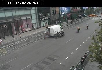 White van and workers appear to be responding to an incident on the roadway.