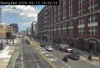 Emergency responders and vehicles are present on the roadway.