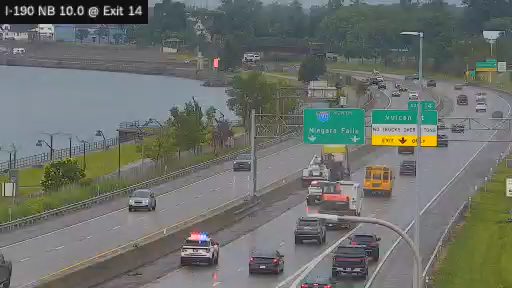 Police car with red and blue lights on the right lane