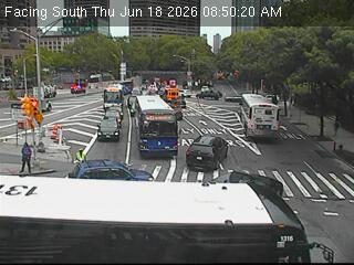 Emergency responders and vehicles are present on the roadway, directing traffic.