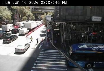 Construction workers and cones on the roadway, possibly directing traffic.