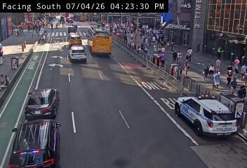 Police car with lights on the right lane
