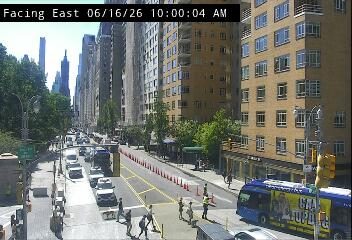 Traffic cones and personnel indicate a possible incident or road work ahead.