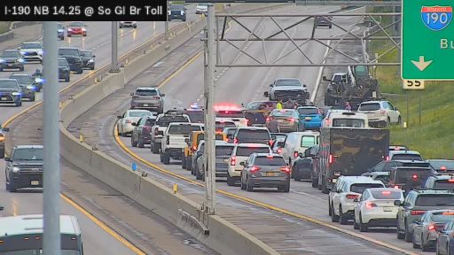 Police car with red and blue lights on the right shoulder