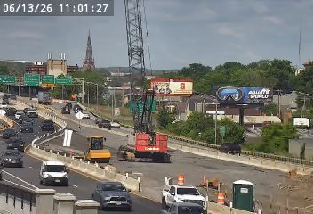 Construction vehicles and equipment on the highway, possibly indicating a work zone or incident response.