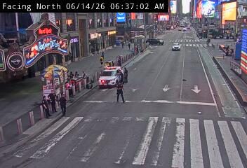 Police officers and a police car are present on the roadway.