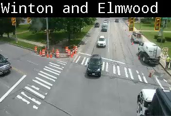 Emergency vehicle and personnel on scene at Winton and Elmwood intersection.
