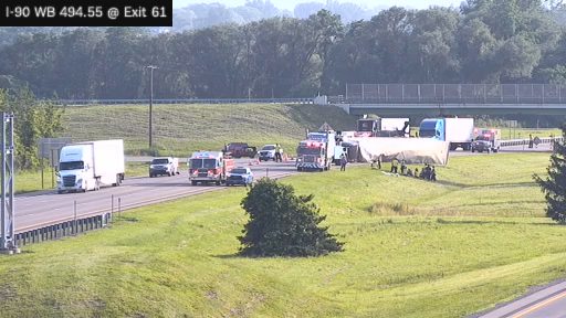 Fire truck and multiple vehicles with emergency lights on the roadway