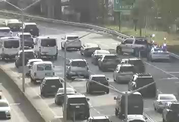 Police car with lights on the right shoulder