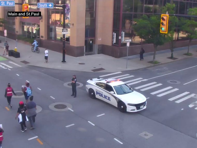 Police car with flashing lights in the intersection