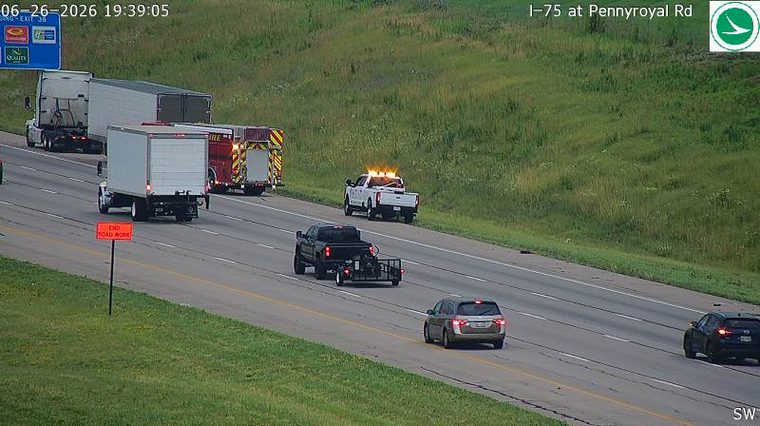 Fire truck and a white pickup truck with amber lights on the right shoulder